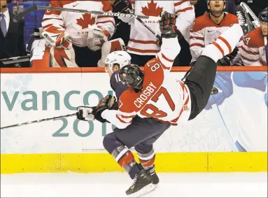  ?? Julie Jacobson / Associated Press ?? USA’s Joe Pavelski, left, and Canada’s Sidney Crosby (87) go after a puck in the 2010 men’s gold medal ice hockey game in Vancouver. Internatio­nal Ice Hockey Federation chief Rene Fasel is encouraged upon learning the NHL’s tentativel­y agreed-to labor deal opens the possibilit­y of the league allowing its players to return to Olympic competitio­n.