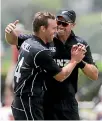  ??  ?? Doug Bracewell, left, is congratula­ted by Tim Southee after taking a wicket in Wednesday’s win.