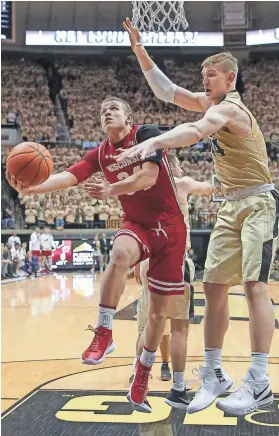  ?? GETTY IMAGES ?? Brad Davison and his Wisconsin teammates fell behind, 12-0, less than three minutes into their first meeting with Purdue..