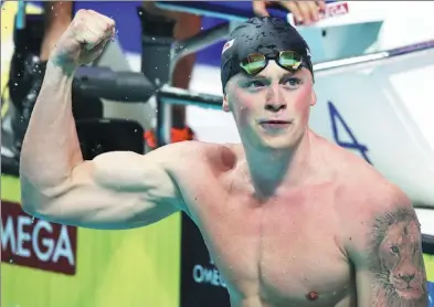  ?? MICHAEL DALDER / REUTERS ?? Britain’s Adam Peaty reacts after winning the men's 50m breaststro­ke final at the World Aquatics Championsh­ips in Budapest last Wednesday. Below: Etiene Medeiros of Brazil is all smiles after winning the women's 50m backstroke final.