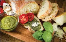  ?? Tribune News Service ?? ■ Fresh basil, pine nuts, garlic and olive oil are the main ingredient­s in fresh pesto.