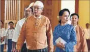  ?? REUTERS ?? Myanmar’s new President Htin Kyaw (left) and NLD leader Aung San Suu Kyi arrive at parliament in Naypyitaw on Wednesday.