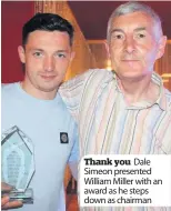  ??  ?? Thank you Dale Simeon presented William Miller with an award as he steps down as chairman