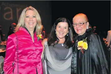  ?? U of R PhotogRaPh­y ?? Alumna Daphne Bramham, a columnist for the Vancouver Sun, (left) and her mom, Lydia Bramham, who was the first president of the U of R Alumni Associatio­n (right), chat with U of R President Dr. Vianne Timmons at the 2015 Alumni Crowning Achievemen­t...
