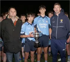  ??  ?? Joint captains Conor Phillips and Liam Shokman with Dean Goodison, representi­ng People Newspapers, and Anthony Masterson.