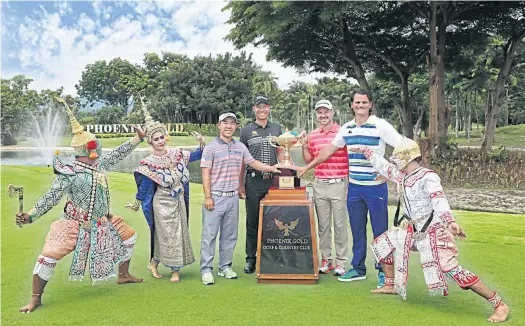  ??  ?? From left, 2012 champion Arnond Vongvanij, Danthai Boonma, Trevor Immelman and Johan Edfors pose with the trophy ahead of this year’s King’s Cup.