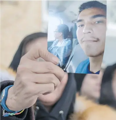  ?? LIAM RICHARDS / THE CANADIAN PRESS ?? Debbie Baptiste, mother of Colten Boushie, holds a picture of her son during a recess at the trial of Gerald Stanley on Monday in Battleford, Sask. Stanley is accused of killing the 22-year-old Indigenous man.