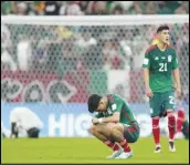  ?? Associated Press ?? Mexico’s Kevin Alvarez (sitting) reacts after his team won a World Cup Group C match 2-1 against Saudi Arabia, but failed to move on in the World Cup, Wednesday, at the Lusail Stadium in Lusail, Qatar.