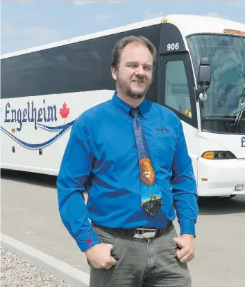  ?? MICHAEL BELL ?? CEO Shane Engel stands near an Engelheim Charter Inc. bus at the company’s office near White City. Engelheim Charter has received Highway Traffic Board approval to take over former STC routes.