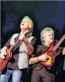  ?? AP PHOTO ?? In this Aug. 20, 2009, file photo, guitarist Justin Hayward, left, and bassist John Lodge of The Moody Blues perform at Radio City Music Hall in New York. The Moody Blues will be inducted to the Rock and Roll Hall of Fame on April 14 in Cleveland, Ohio.