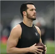  ?? JOHN LOCHER — THE ASSOCIATED PRESS ?? Quarterbac­k Derek Carr thought he would end his playing days with the Las Vegas Raiders, but that has changed.