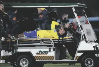  ?? CAMPODONIC­O AP PHOTO/MATILDE ?? Brazil’s Neymar is carried off the pitch on a stretcher after being injured during a qualifying soccer match for the FIFA World Cup 2026 against Uruguay at Centenario stadium in Montevideo, Uruguay, on Tuesday.