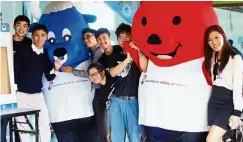  ??  ?? Money talks: Chai (second from left) and his team pose with the Bursa Malaysia mascots at the event.