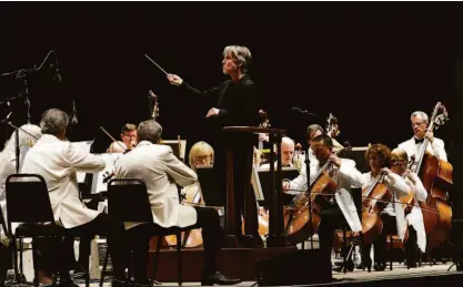  ?? Josie Lepe / Special to the Chronicle ?? Music Director Esa-Pekka Salonen leads the San Francisco Symphony last month in the orchestra’s first concert of a weekly summer series at Stanford’s Frost Amphitheat­er.