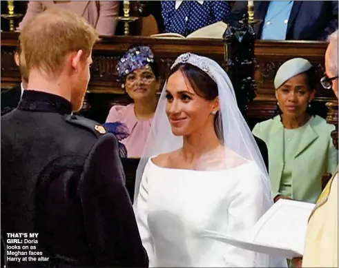  ??  ?? THAT’S MY
GIRL: Doria looks on as Meghan faces Harry at the altar