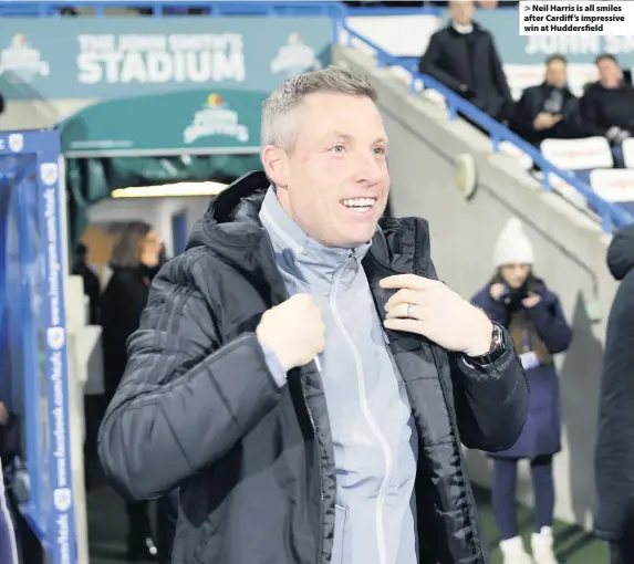  ??  ?? > Neil Harris is all smiles after Cardiff’s impressive win at Huddersfie­ld