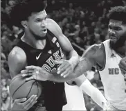  ?? ETHAN HYMAN/TRIBUNE NEWS SERVICE ?? On January 6, 2018, Duke's Marvin Bagley III (35) is fouled by North Carolina State's Lennard Freeman (1) at PNC Arena in Raleigh, N.C. on March 3.