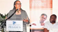  ??  ?? Sharon Hay-Webster delivered greetings on behalf of Minister of Education and Informatio­n Ruel Reid. Looking on is Dr Tony Sewell, facilitato­r for the week of events.