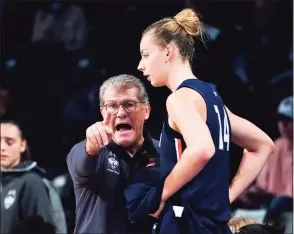  ?? John Bazemore / Associated Press ?? UConn coach Geno Auriemma talks to forward Dorka Juhasz during the first half against Georgia Tech on Dec. 9.