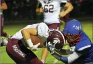  ?? BY NICK TOPPING- NTOPPING@ DIGITALFIR­STMEDIA. COM ?? South Glens Falls’ Dylan Schrammel takes down Burnt Hills- Ballston Lake’s Jacob Stanko, pulling on the front of his helmet. Schrammel was called for a face mask, helping Burnt Hills get the easy touchdown.