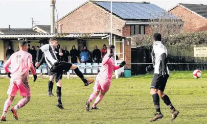  ??  ?? Stuart Mcnaught puts Shepshed 1-0 up against Highgate United. Picture by Steve Straw.