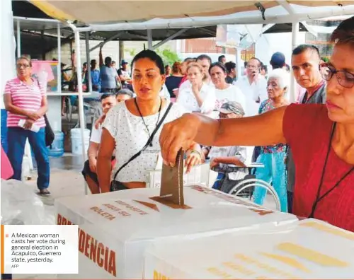  ?? AFP ?? A Mexican woman casts her vote during general election in Acapulco, Guerrero state, yesterday.