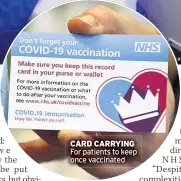  ??  ?? CARD CARRYING For patients to keep once vaccinated