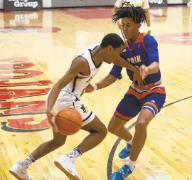  ??  ?? Executive Education Academy Charter’s Amari Mills, pushes through York’s Antoine Beard during the Lehigh Valley Hoop Group Showcase on Sunday.