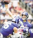  ?? Michael Wyke / Associated Press ?? Giants quarterbac­k Eli Manning threw a pair of touchdown passes in Sunday’s win over the Texans in Houston.