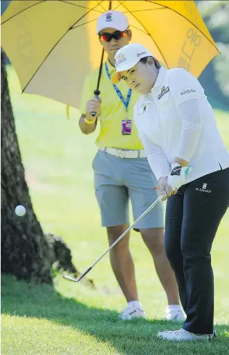  ?? MARK VAN MANEN / PNG ?? Inbee Park chips her ball onto the seventh green during a pro- am tournament Wednesday at the Canadian Pacific Women’s Open at the Vancouver Golf Club in Coquitlam, B. C., Park, the world’s No. 1 women’s player, has 16 career tournament victories,...