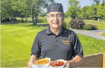  ?? PHOTOS BY RYAN TAPLIN • THE CHRONICLE HERALD ?? Passage to India co-owner Amar (Sunny) Sethi holds a plate with vegetable korma and butter chicken, two items on the menu at his new location at the Granite Springs Golf Club in Bayside.