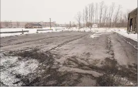  ??  ?? The ride-sharing staging lot for Lyft and Uber vehicles is empty on Monday. Many drivers say they like the flexibilit­y of gig work.