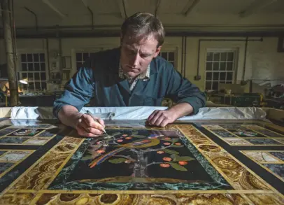  ??  ?? Above: Restoring a table designed by William Burges in about 1867 from Lotherton Hall, West Yorkshire. Below: Green Russian malachite and verde Valle d’aosta in a parrot’s plumage