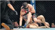  ?? /Stephen R Sylvanie-USA TODAY Sports ?? Gotcha: Khabib Nurmagomed­ov (red gloves) has Conor McGregor in a choke hold.