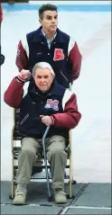  ?? Photo by Ernest A. Brown ?? Bishop Hendricken hockey coach Jim Creamer said Mount’s Dave, standing, and Bill, sitting, Belisle have made him a better coach.