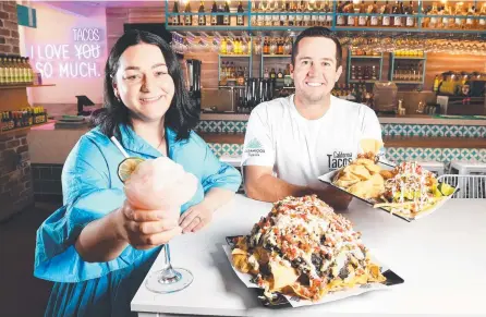  ?? ?? California Tacos Townsville franchisee Jessica Brereton pictured with California Tacos franchisor Ty Yturralde, in the new Townsville restaurant. Picture: Shae Beplate