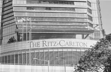  ??  ?? A general view shows signage for the Ritz-Carlton hotel located in the Internatio­nal Commerce Centre (centre) in Hong Kong. — AFP photo