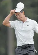  ??  ?? David J. Phillip The Associated Press Rory Mcilroy’s run of 10 consecutiv­e times playing the weekend at Augusta National ended when he finished 6 over. His quest to complete the career Grand Slam will wait until 2022 at least.