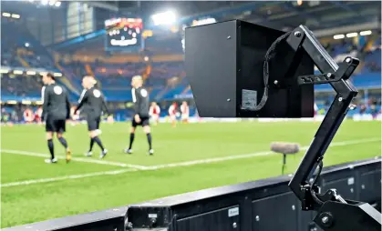  ??  ?? Camera shot: Martin Atkinson (below) was subject to frenzied demands to use the VAR at Stamford Bridge