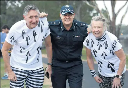  ?? Picture: PAUL CARRACHER ?? GOTCHA: Superinten­dent Ian Milner collars Wayne Street and Kay Eyles at Wimmera River Cops and Robbers parkrun. For more pictures visit www.theweeklya­dvertiser.com.au.