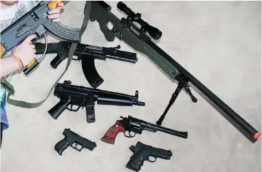  ??  ?? Airsoft guns shoot small plastic BBs, but look like real firearms.