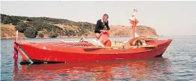  ??  ?? Colin Quincey in the open wooden Yorkshire dory he built.