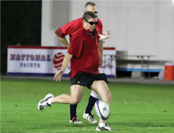  ?? Pawan Singh / The National ?? Hamish Mackenzie, who played for Wanderers from the age of 17 until 26, makes the ceremonial kick-off at a memorial match.