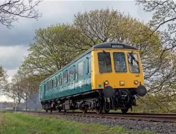  ?? (Martyn Tattam) ?? The East Lancashire Railway re-opened post lockdown during the
May Bank Holiday weekend but it was not without its problems. The line’s Class 122 Bubble Car L101 was used to ferry passengers between Rawtenstal­l and Ramsbottom due to issues with track work just south of Irwell Vale. The Bubble is seen passing Springside Farm with the ECS from Bury on May 1.