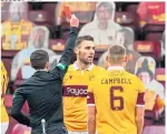  ??  ?? Stephen O’donnell is shown a red card by referee David Munro