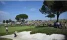  ?? Ellis/AFP/Getty Images ?? Scottie Scheffler plays from a bunker on the 10th during practice. Photograph: Paul