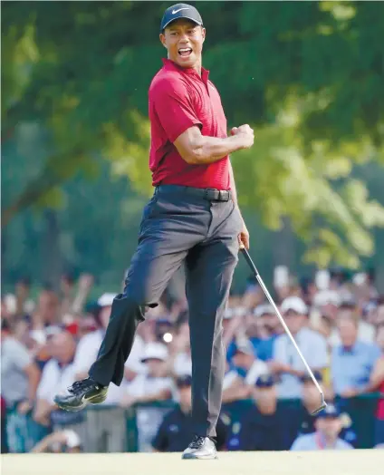  ?? AP FOTO/BRYNN ANDERSON ?? 19-FOOTER. Tiger Woods celebrates after closing out with a 19-foot birdie on the 18th.