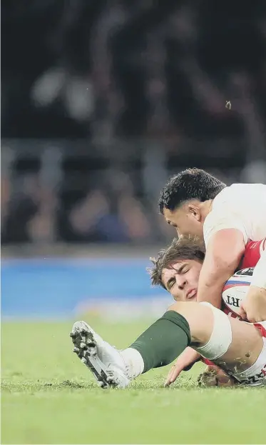  ?? ?? England’s Ellis Genge challenges Taine Basham of Wales in the Guinness Six Nations match at Twickenham. Photo: