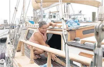  ?? JOE CAVARETTA/SOUTH FLORIDA SUN SENTINEL ?? Olanea Amstel prepares her 51 foot 1974 Formosa for upcoming Hurricane Dorian at the Riviera Beach marina.