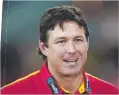  ??  ?? Gold Coast Suns coach Stuart Dew was busted urinating against a pub wall during a booze-up with club officials.